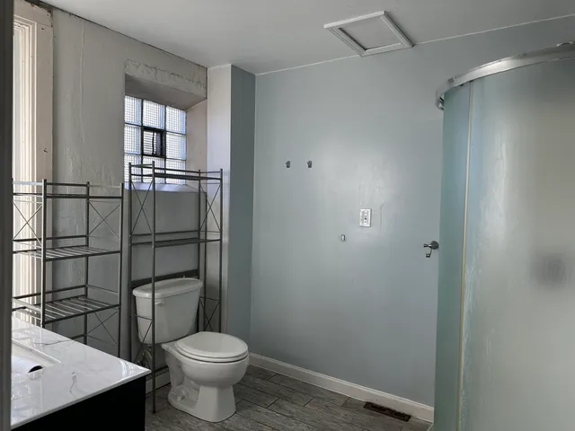 a bathroom with a toilet and a sink