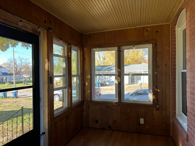 a front view of a house with a large window