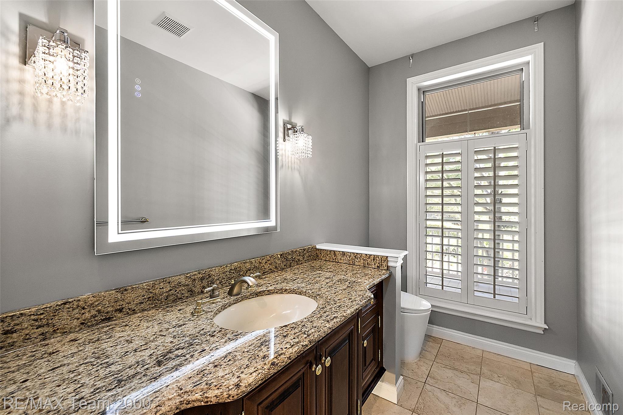 630 Sheldon Court Rochester, MI 48306 - Photo 52 of 94 Half bathroom with vanity and light tile patterned floors