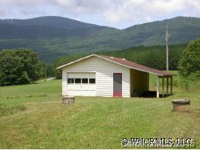 1942 Coopers Gap Road Mill Spring, NC 28756 - Photo 4 of 12 a view of a backyard of the house