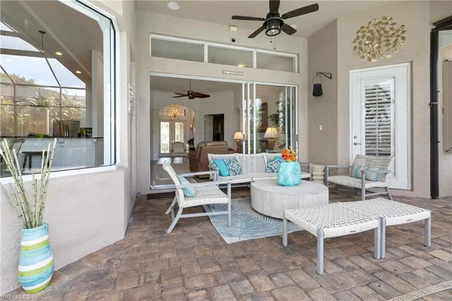 a view of a tennis ground with a table in the patio