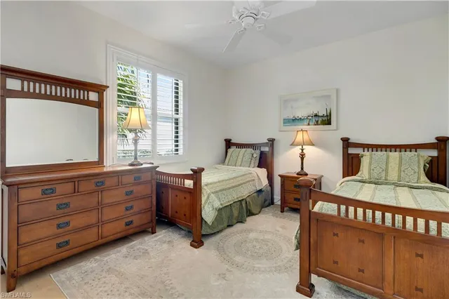 a bedroom with bed and window