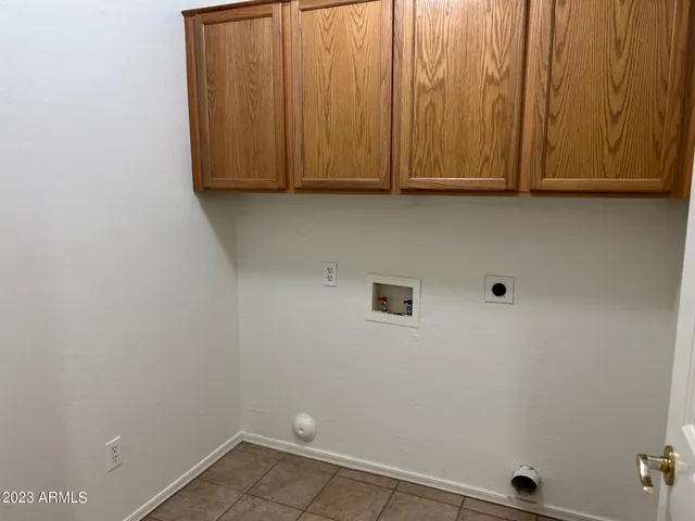 a view of storage and utility room with window