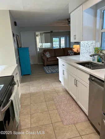 a kitchen with stainless steel appliances granite countertop a stove a microwave and cabinets