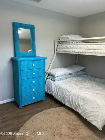 a bedroom with a bed and chair