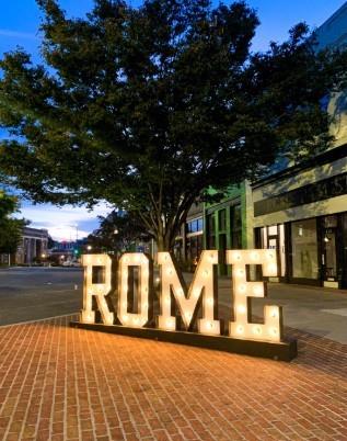 0 East Lakeshore Drive Rome, GA 30161 - Photo 10 of 12 a view of a building with floor to ceiling windows and a basket ball ground