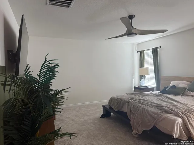 a view of an empty room with windows