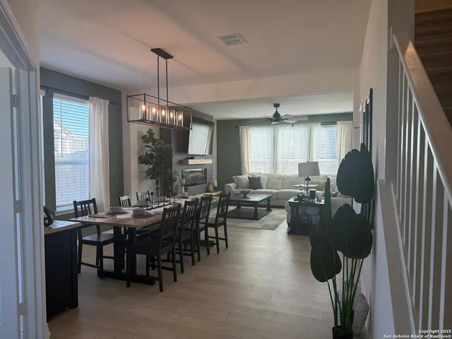 a group of people sitting in a living room