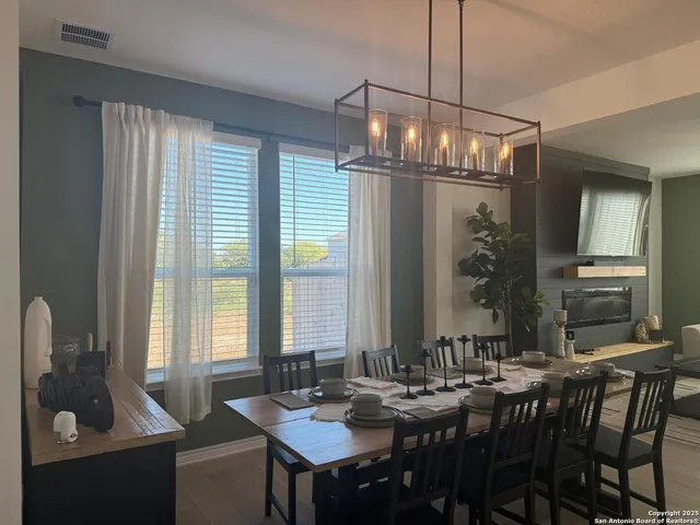 a view of a dining room with furniture window and outside view