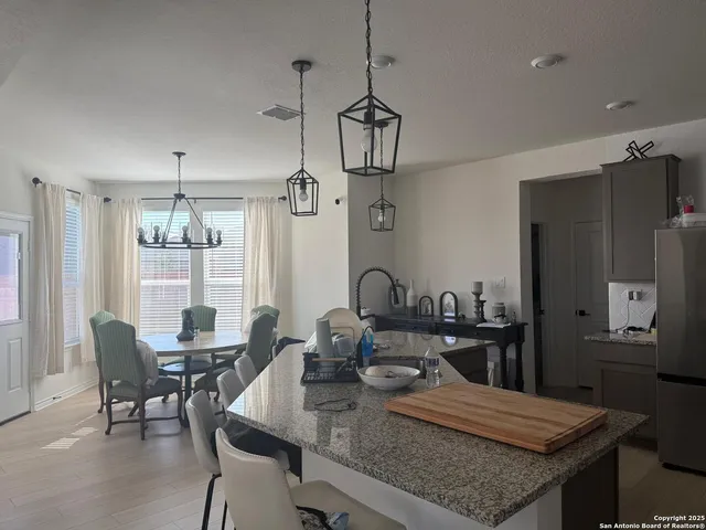 a view of a dining room with furniture window and outside view