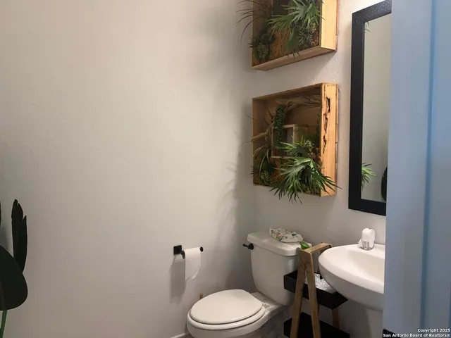 a bathroom with a toilet and a sink