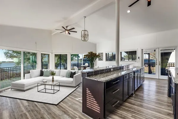 a kitchen with stainless steel appliances granite countertop a stove and cabinets