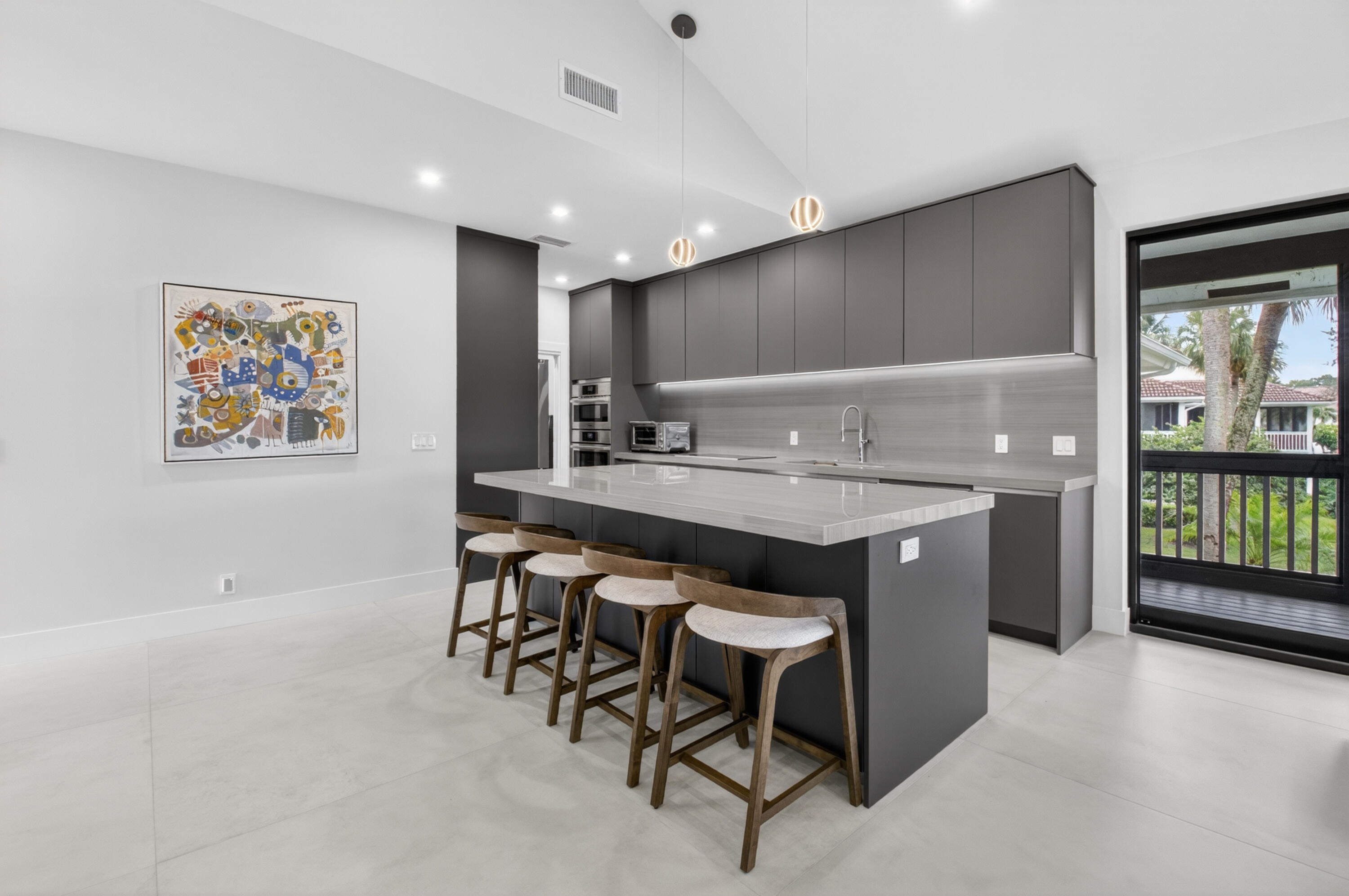 19221 Sabal Lake Drive, Unit 5124 Boca Raton, FL 33434 - Photo 5 of 98 a kitchen with a table and chairs