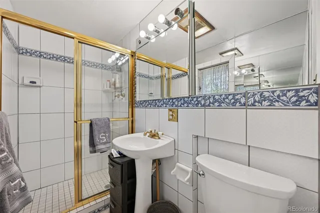 a bathroom with a shower and a sink