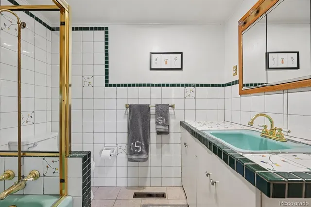 a bedroom with furniture and a book shelf