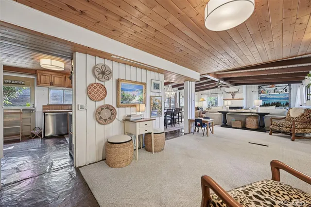 a bathroom with a sink and mirror with bathtub