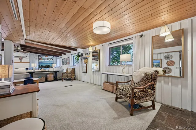 a kitchen that has a lot of cabinets a sink and a refrigerator in it