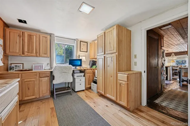 a living room with a couch and a dining table