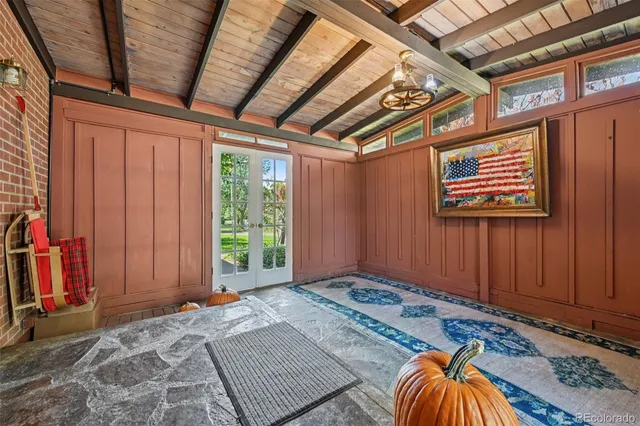 a view of a patio with table and chairs and potted plants