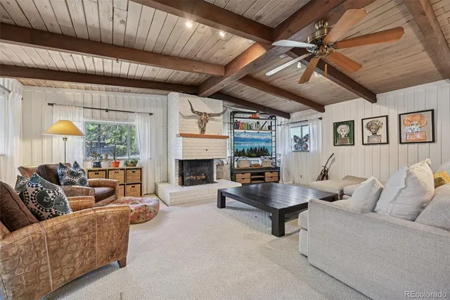 a living room with furniture and a table