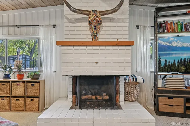 a dining room with wooden floor and furniture
