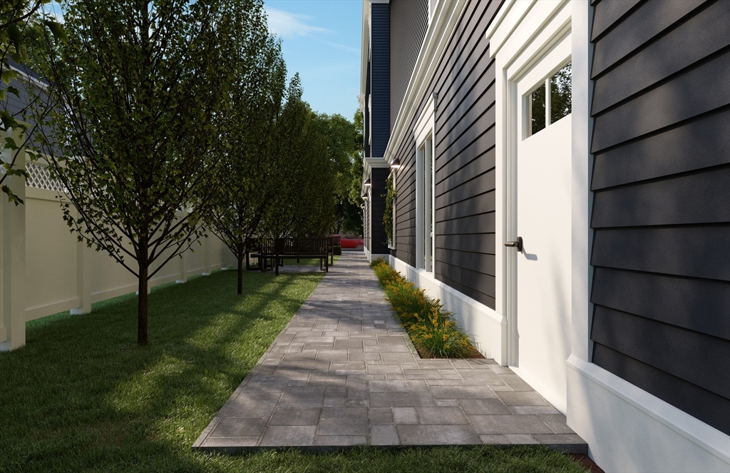 61 High Street Danvers, MA 01923 - Photo 6 of 7 a view of a pathway with a house