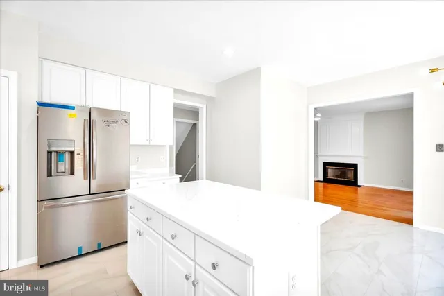 a kitchen with stainless steel appliances a refrigerator and a stove