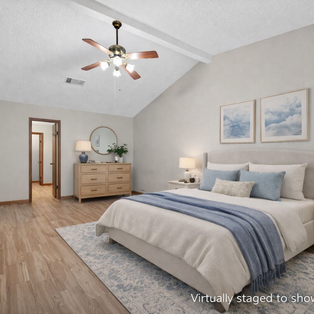 11803 Inga Lane Houston, TX 77064 - Photo 20 of 39 This bedroom features a cozy layout with vaulted ceilings, wood flooring, and neutral walls. It includes a comfortable bed with soft bedding, a wooden dresser, and stylish decor. A ceiling fan adds comfort, and the room is well-lit and welcoming.