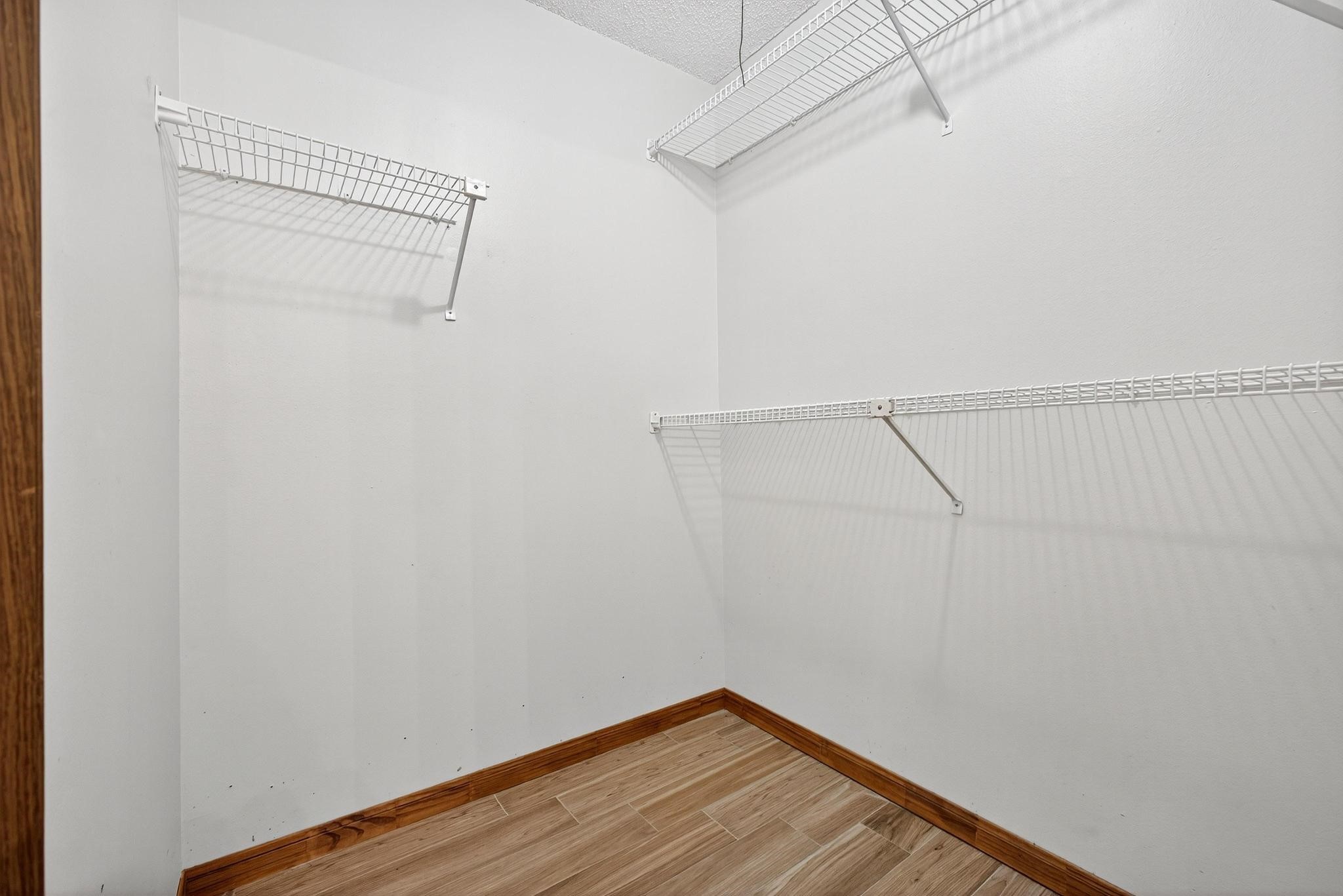 11803 Inga Lane Houston, TX 77064 - Photo 29 of 39 Discover ample storage in Closet #2, featuring sleek wire shelving and a bright, open layout perfect for organizing your wardrobe.