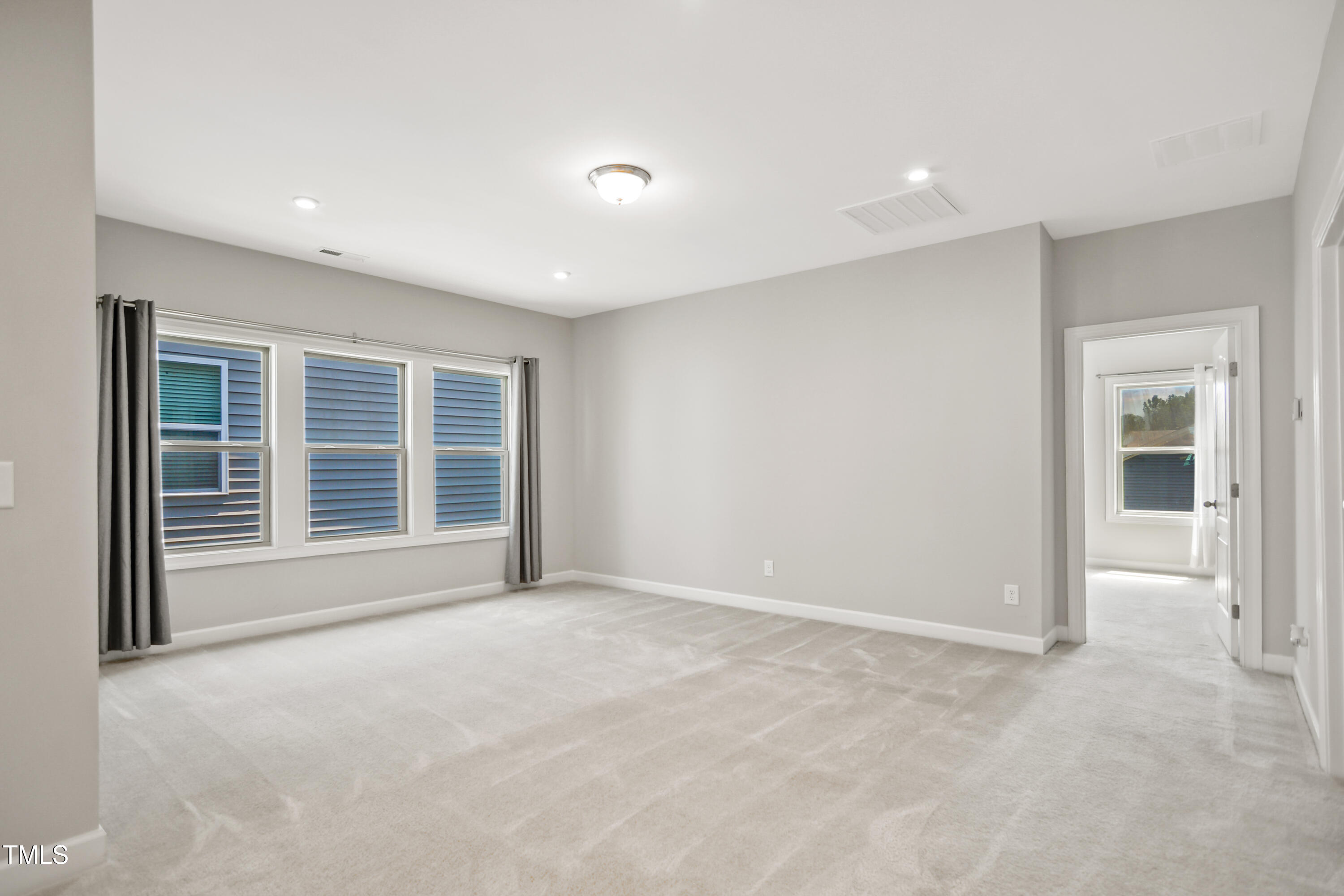 917 Lippincott Road Durham, NC 27703 - Photo 14 of 30 a view of an empty room with a window