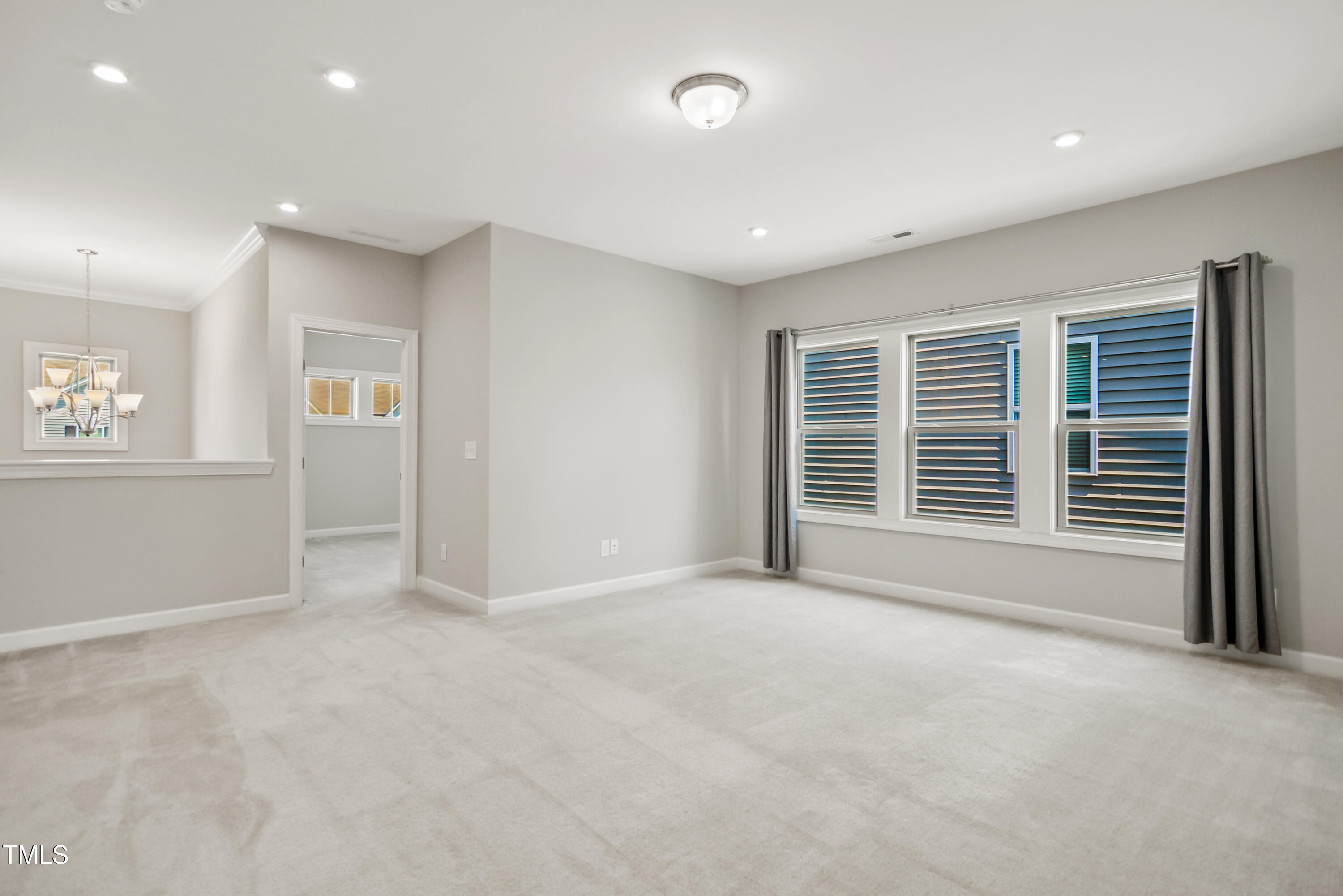917 Lippincott Road Durham, NC 27703 - Photo 16 of 30 a view of an empty room with a window
