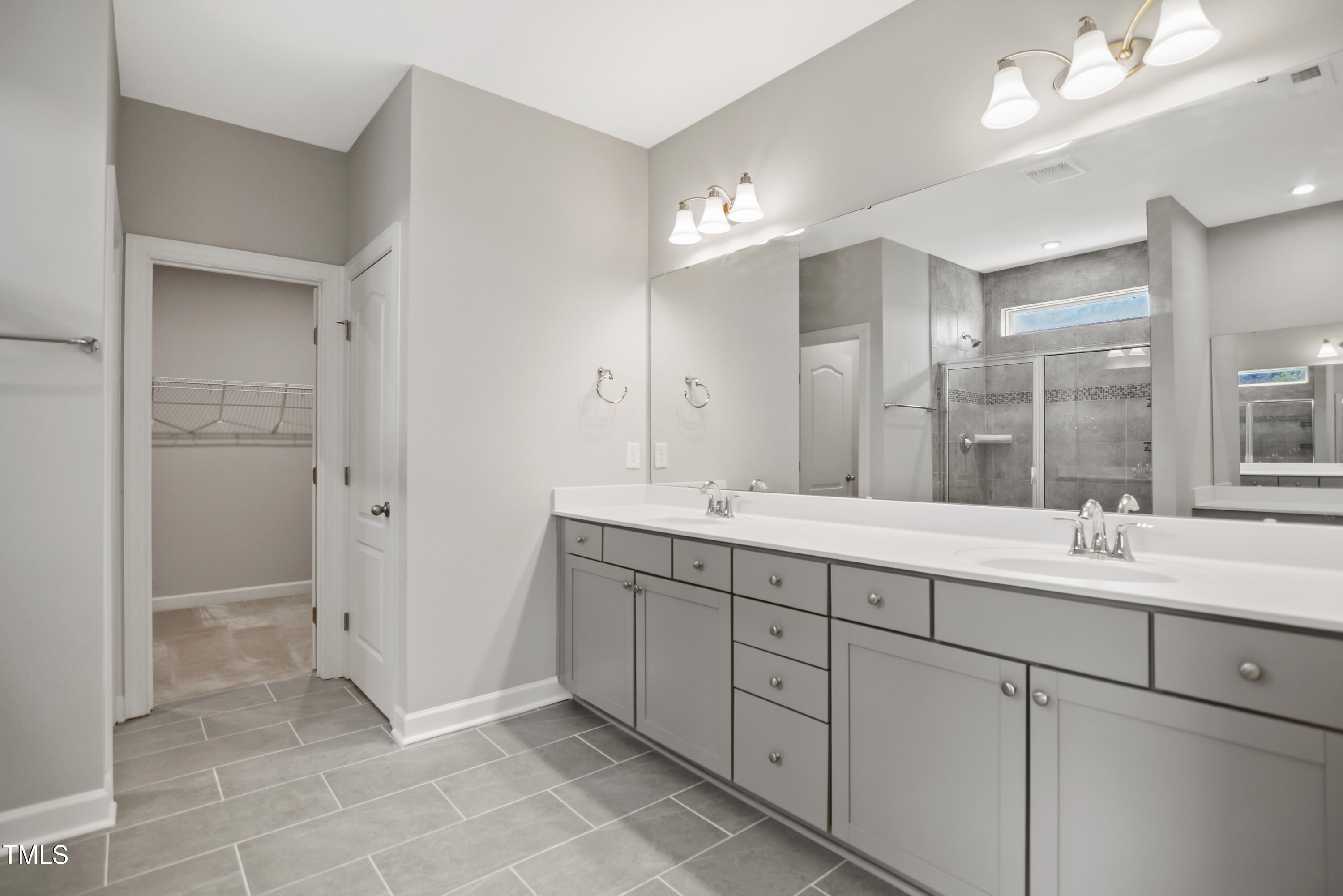917 Lippincott Road Durham, NC 27703 - Photo 19 of 30 a bathroom with a double vanity sink mirror and double