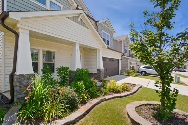front view of a house with a garden