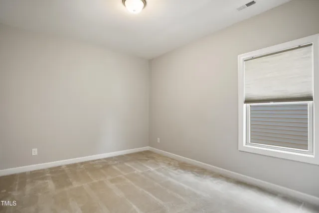 a view of a room that has a window in it