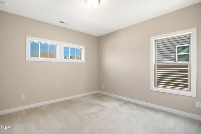 a view of empty room with windows