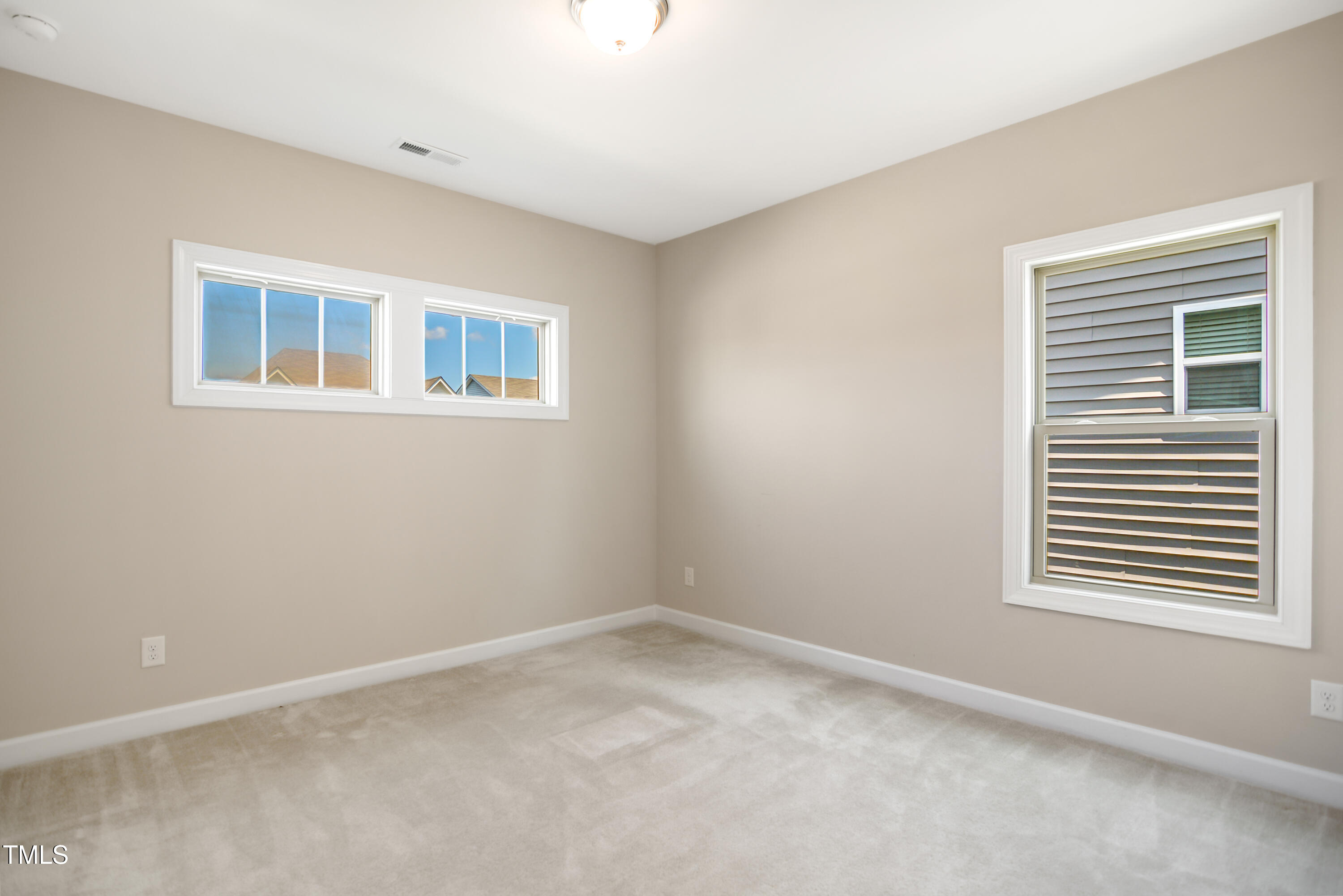 917 Lippincott Road Durham, NC 27703 - Photo 24 of 30 a view of empty room with windows