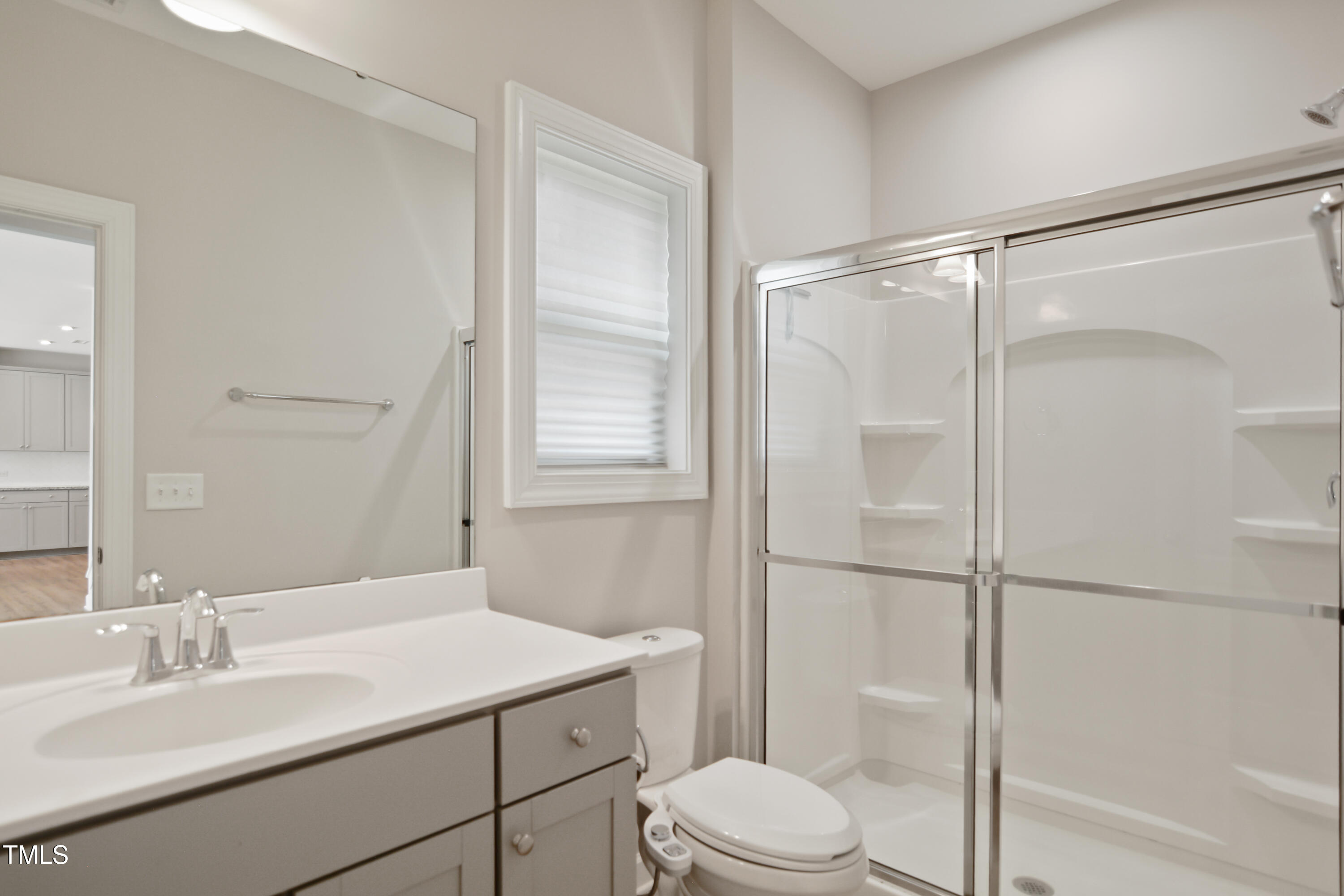 917 Lippincott Road Durham, NC 27703 - Photo 27 of 30 a bathroom with a sink toilet and shower