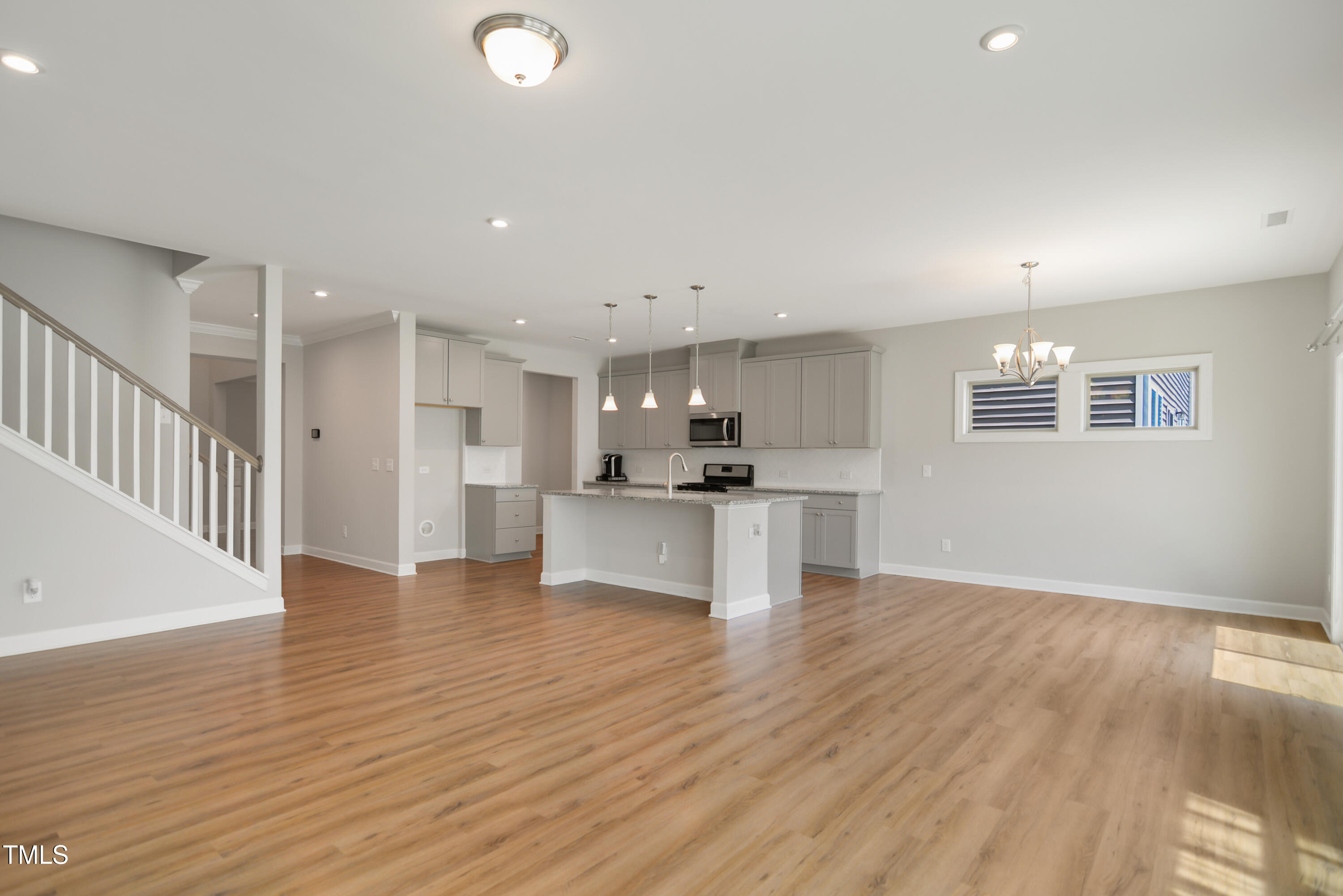 917 Lippincott Road Durham, NC 27703 - Photo 9 of 30 a view of kitchen with wooden floor and windows