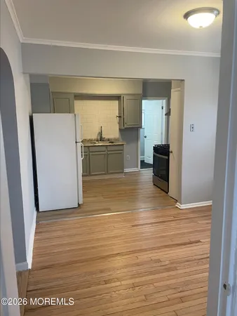 a view of kitchen and wooden floor