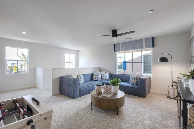 a living room with furniture and a window