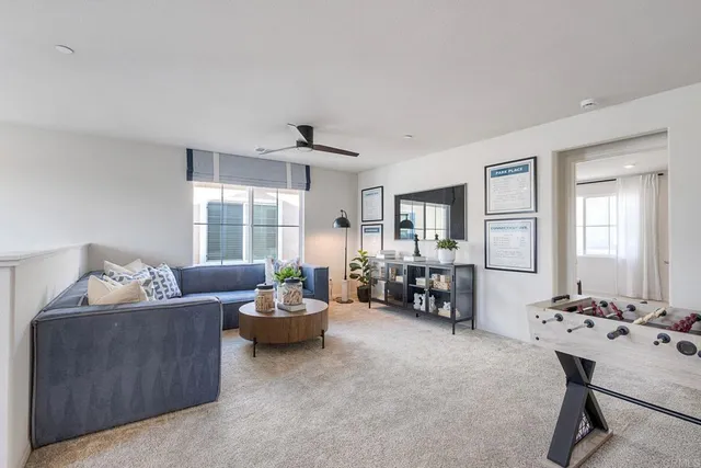 a living room with furniture and natural light