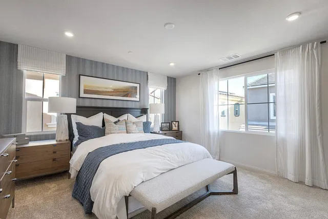 a bed room with a bed and a window