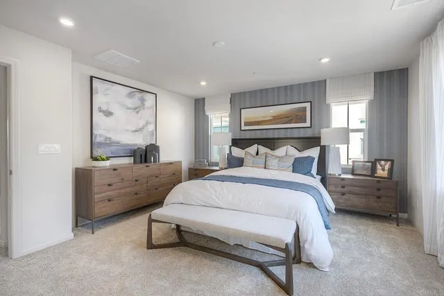 a bedroom with furniture and window