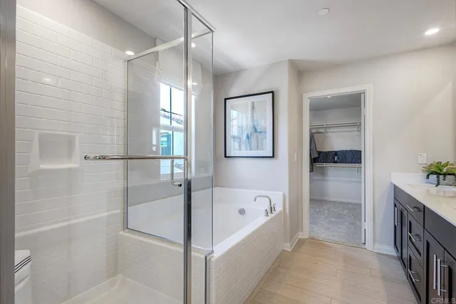 a bathroom with a bathtub and a shower