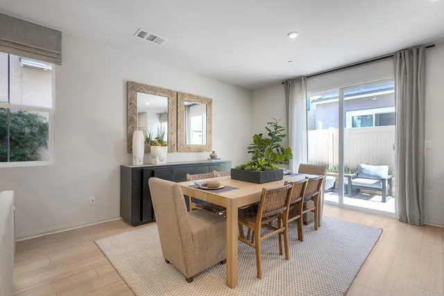 a dining room with furniture and window