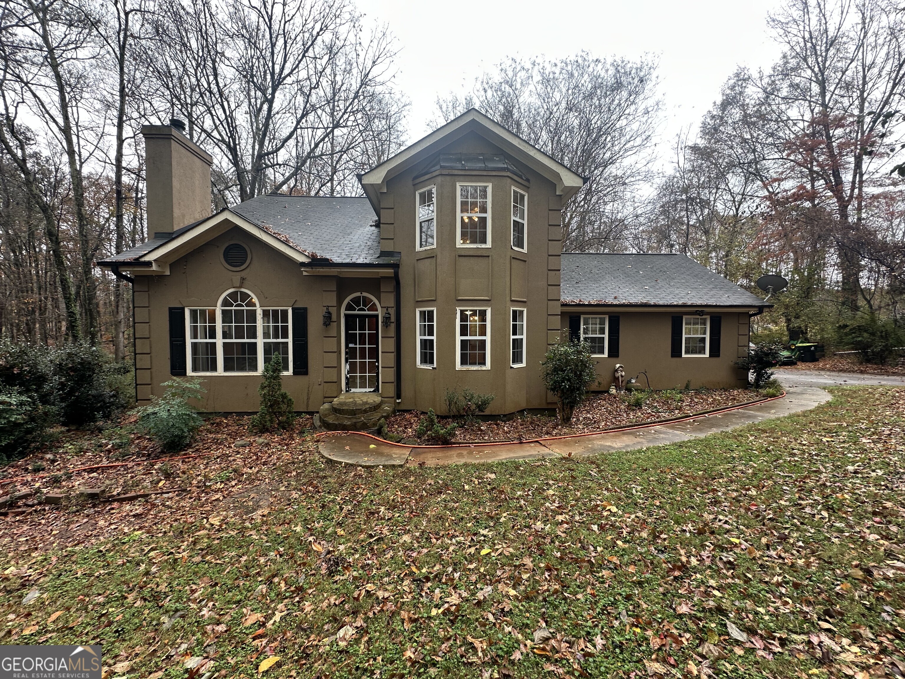 a front view of a house with garden