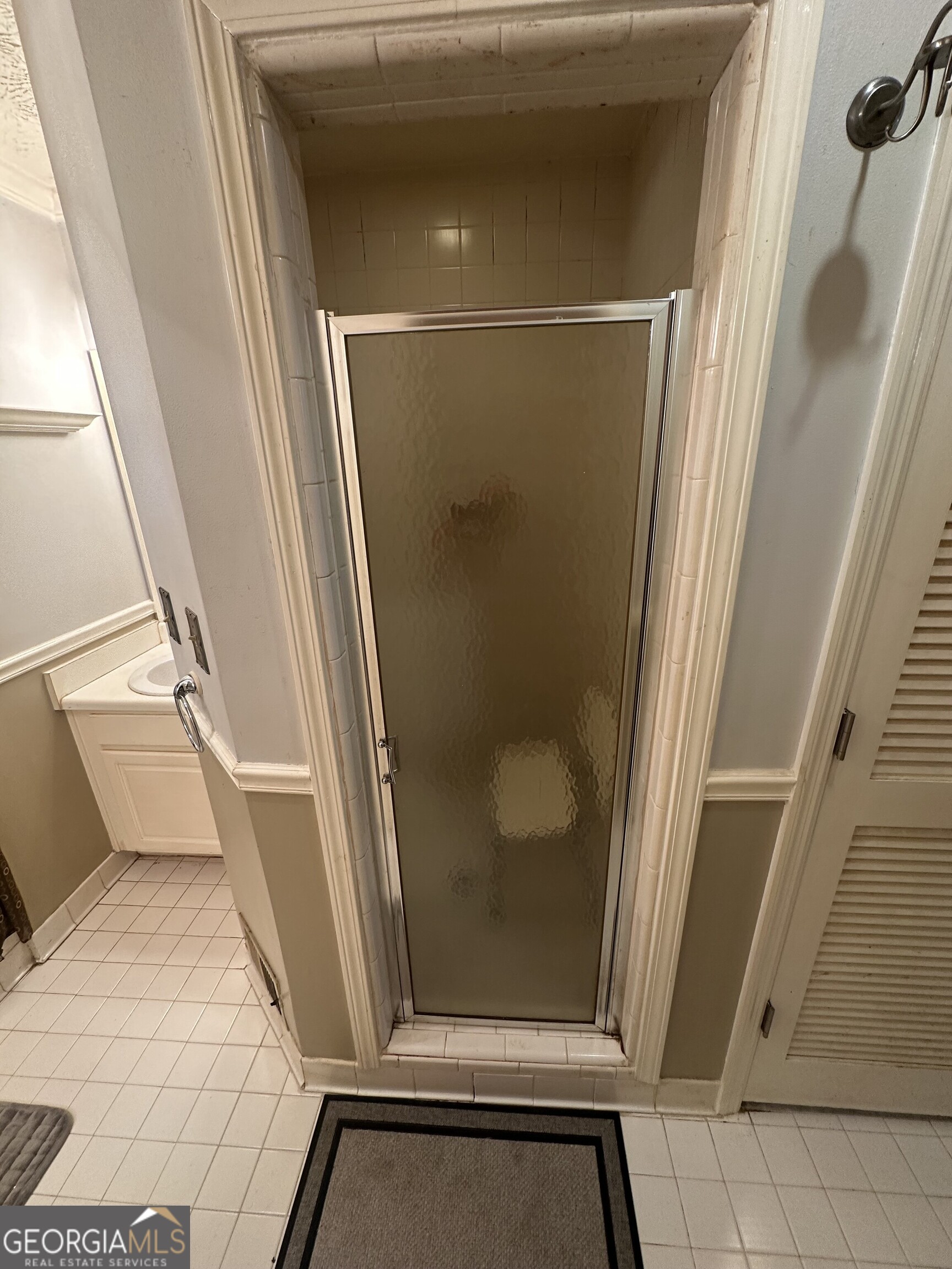 565 Patillo Road Stockbridge, GA 30281 - Photo 23 of 31 a bathroom with a glass door shower and toilet