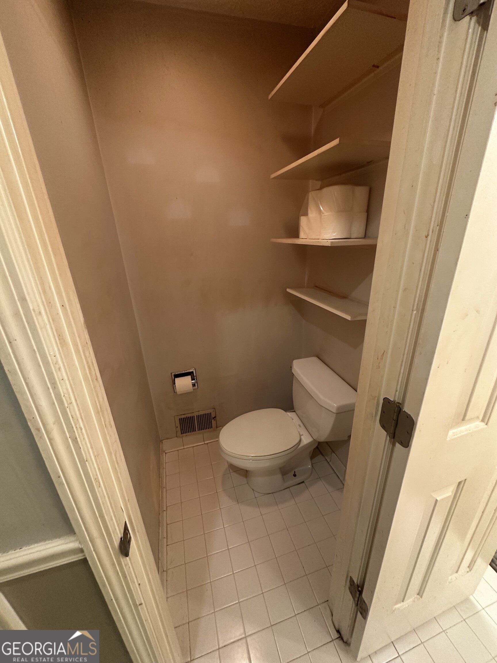 565 Patillo Road Stockbridge, GA 30281 - Photo 24 of 31 a bathroom with a toilet and a shower