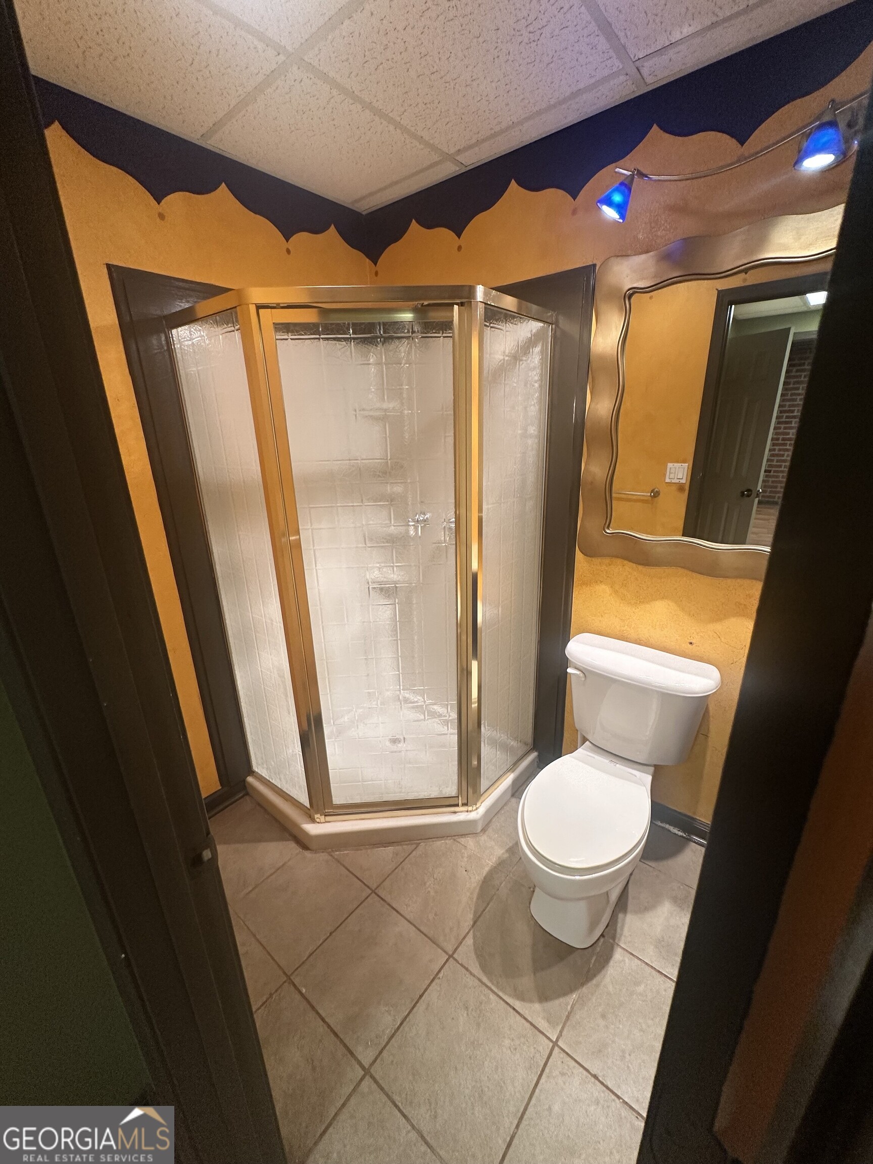 565 Patillo Road Stockbridge, GA 30281 - Photo 3 of 31 a bathroom with a granite countertop sink toilet and shower