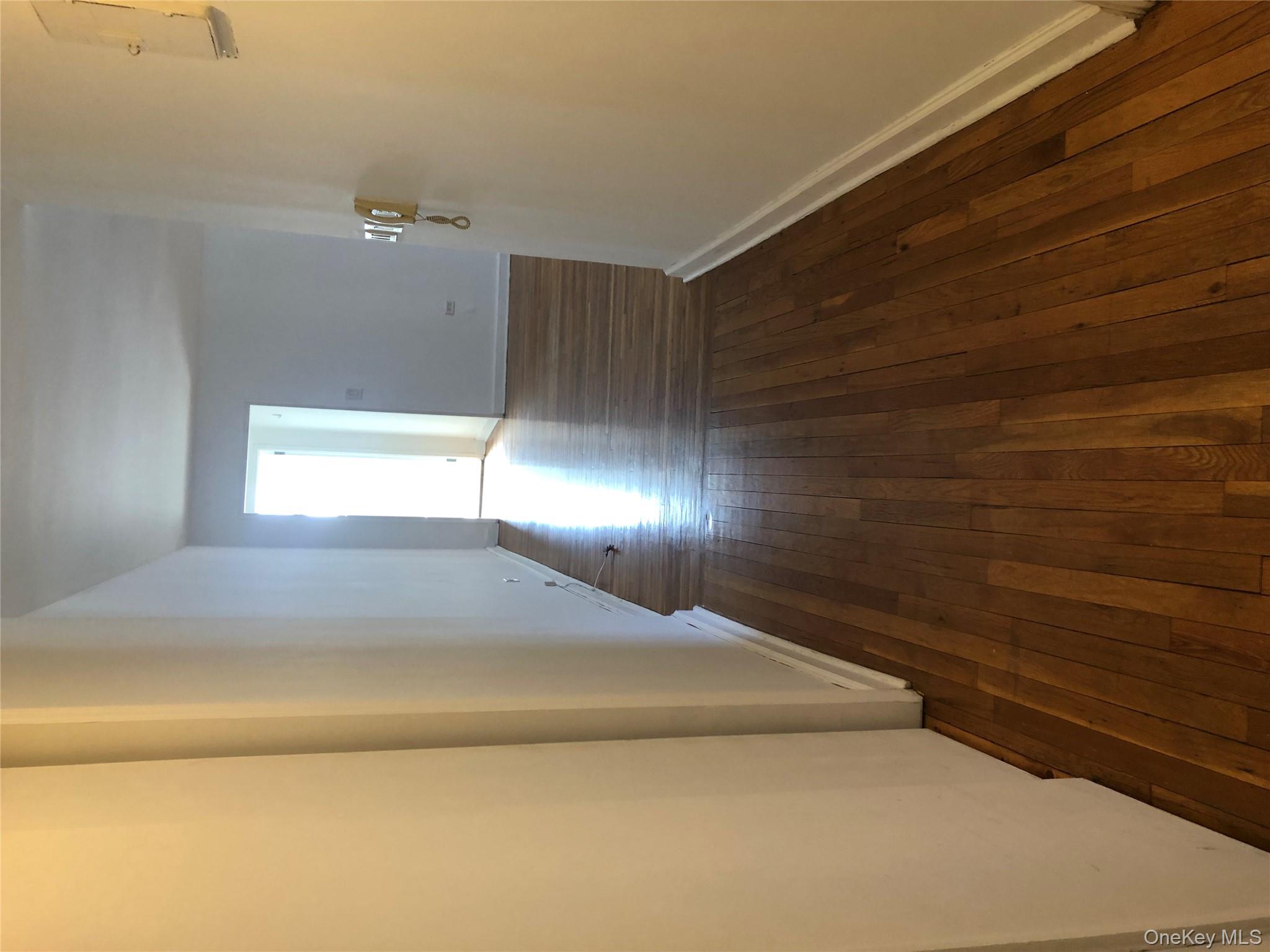 66-33 Yellowstone Boulevard, Unit 2B Queens, NY 11375 - Photo 12 of 13 a view of a hallway with wooden floor